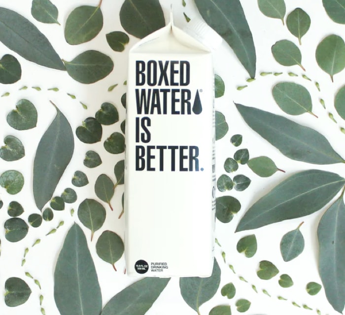 a beverage carton with leaves intricately placed about